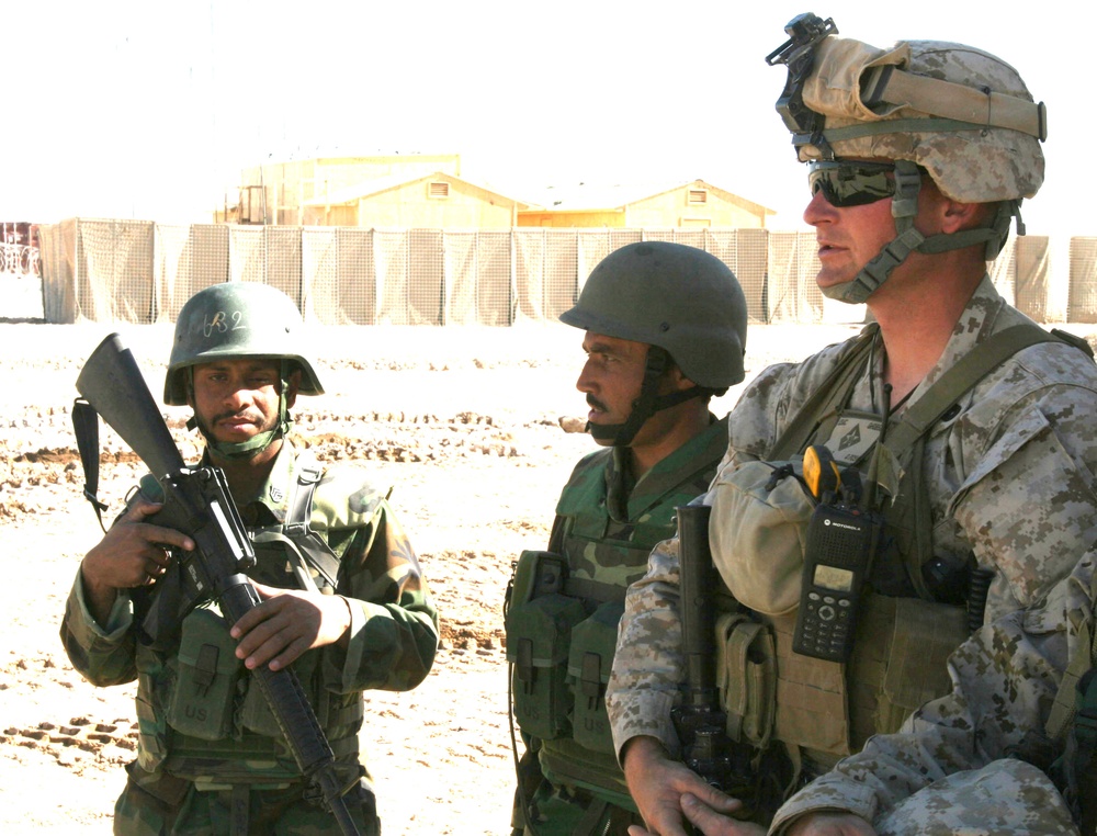 Marine, Afghan Soldiers Discuss Patrol in Helmand Province
