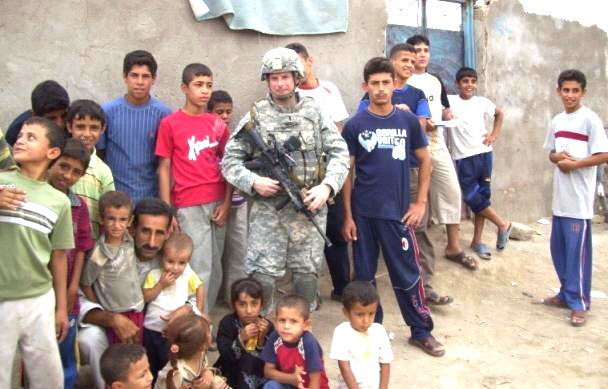 U.S. Soldier Connects with Iraqi Children During Patrol in Basra