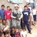 U.S. Soldier Connects with Iraqi Children During Patrol in Basra