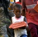 Troops Distribute Humanitarian Meals to Women and Children in Haiti