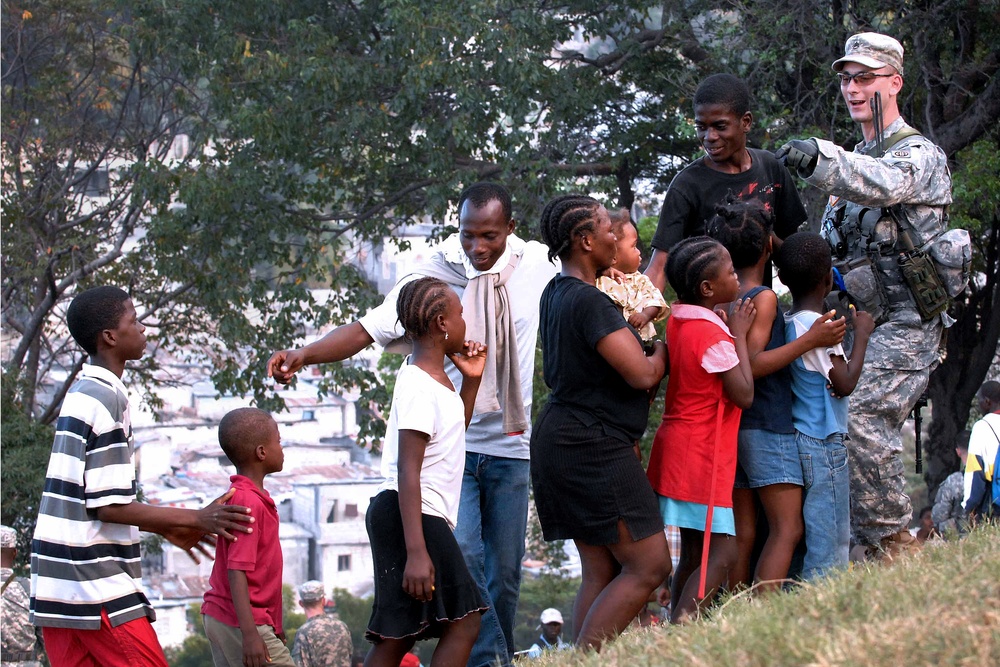 Soldiers Provide Aid to Haitian Civilians After Earthquake