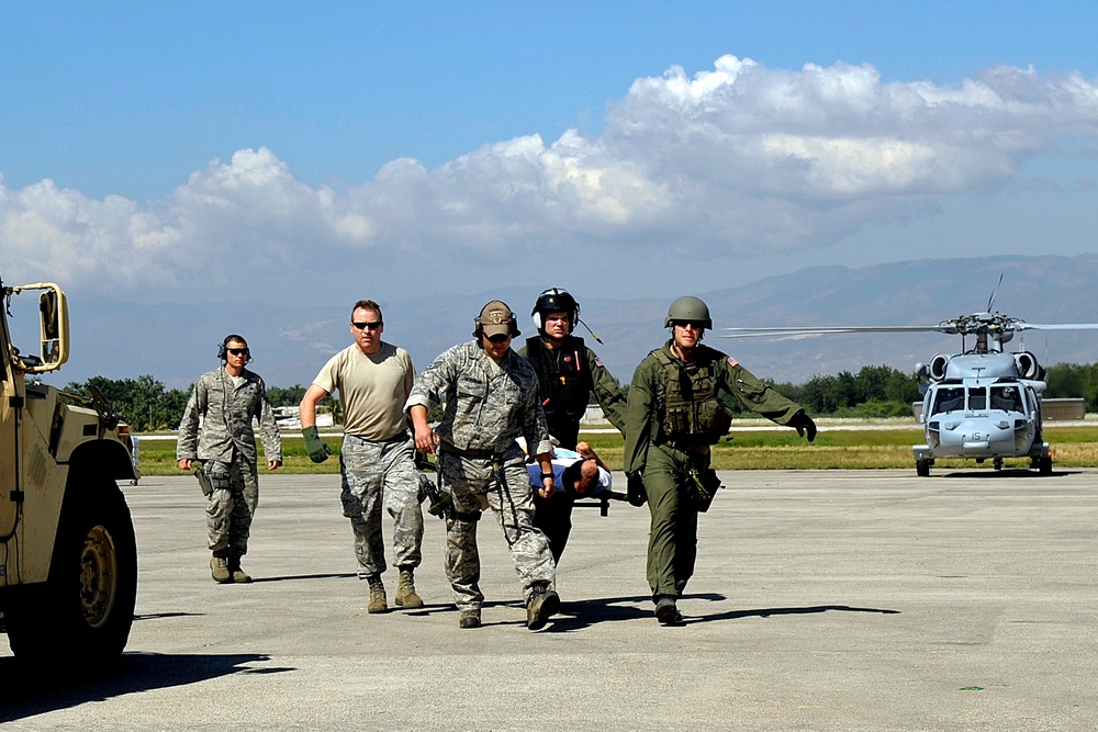 Air Force Airmen Evacuate Injured in Haiti Earthquake Relief Effort