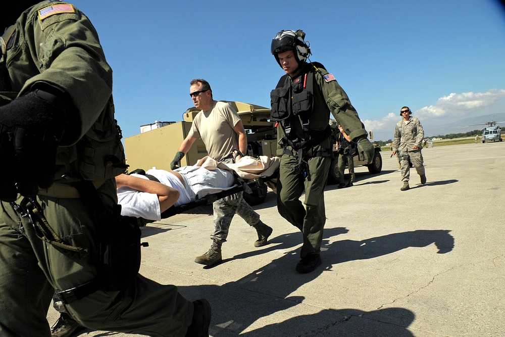 Air Force Airmen Evacuate Injured in Haiti Earthquake Relief Effort