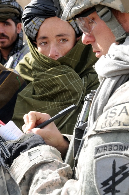 Army Sergeant Engages with Afghan Villagers During Reconstruction Effort