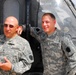 Father and Son Soldiers Pose with Black Hawk Helicopter in Iraq