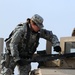 Soldier Prepares M240B Machine Gun for Live-Fire Exercise in Iraq