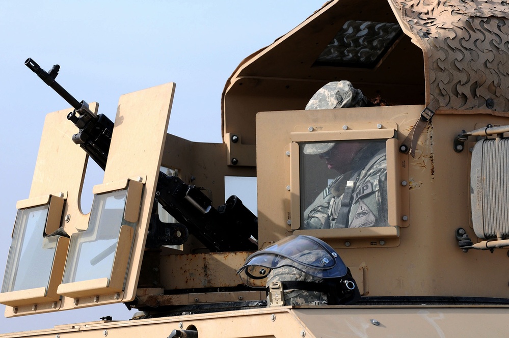 Soldier Mounts M240B Machine Gun for Live-Fire Convoy Exercise in Iraq