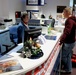 USO Volunteer Welcomes Marine at Airport During Holiday Travel