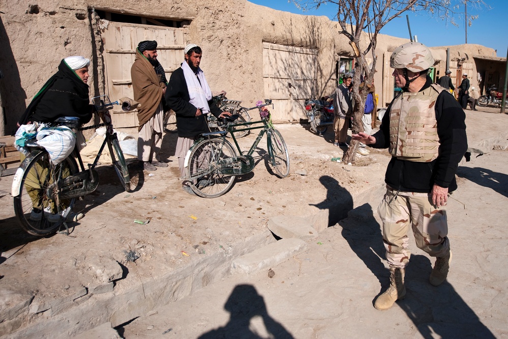 U.S. Military Leader Connects with Afghan Villagers During Market Visit