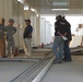 Army Staff Sgt. Laughs with Iraqi Contractor in Basra