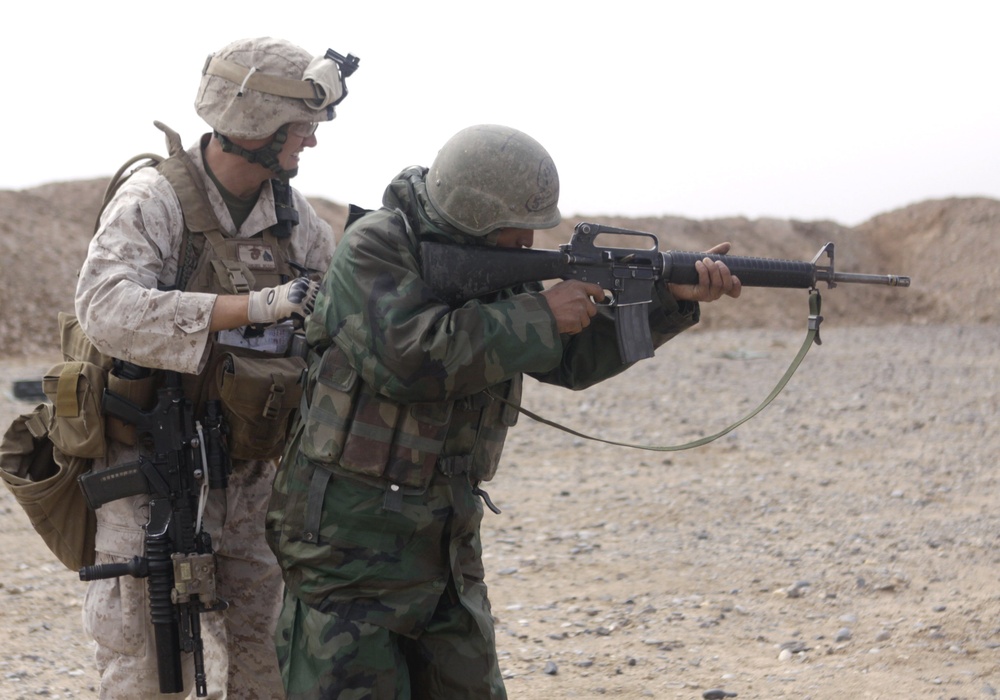 Marine Sergeant Trains Afghan Soldier in Pashto at Forward Operating Base in Afghanistan
