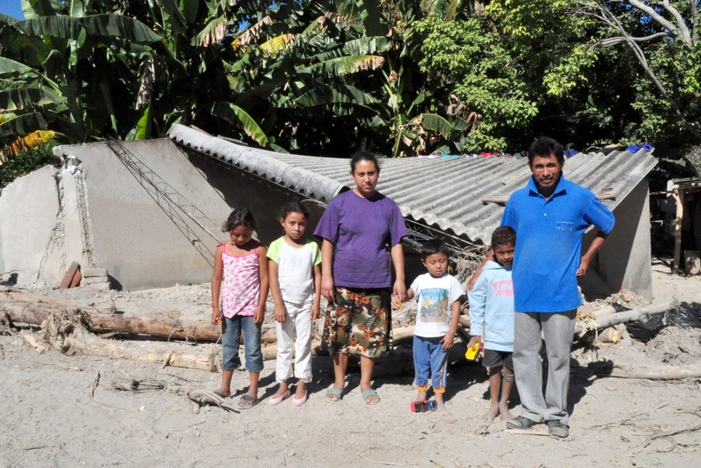 Salvadoran Family Surveys Flood Damage to Home