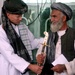 Marine Officer Presents Afghan Leader with Ceremonial Sword