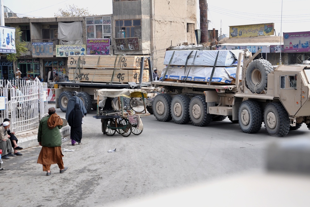 U.S. Military Cargo Truck Transports Lumber for Afghan Base Expansion