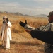 U.S. Soldier Supervises Afghan Worker at Forward Operating Base in Afghanistan