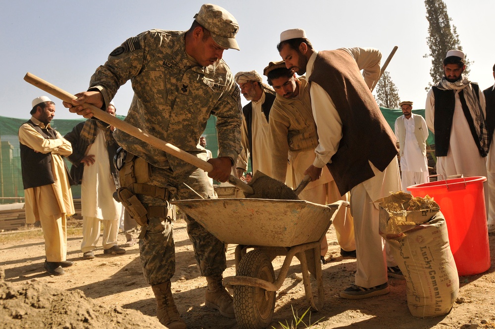 U.S. Sailor Instructs Afghan Contractors on Mortar Mixing Technique