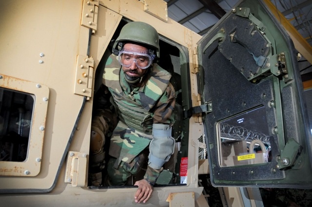 Afghan Soldier Practices Exiting Humvee During Training