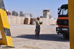 Army Spc. Directs Cargo Truck at Kandahar Airfield