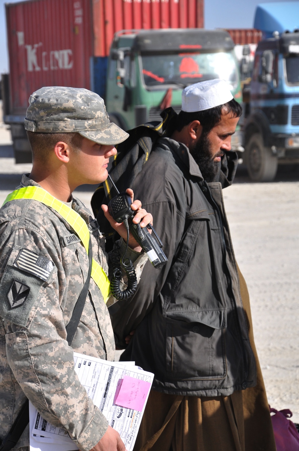 U.S. Soldier Escorts Afghan Driver at Kandahar Airfield