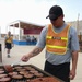 Soldier Cooks Up Barbecue at Iraq Base