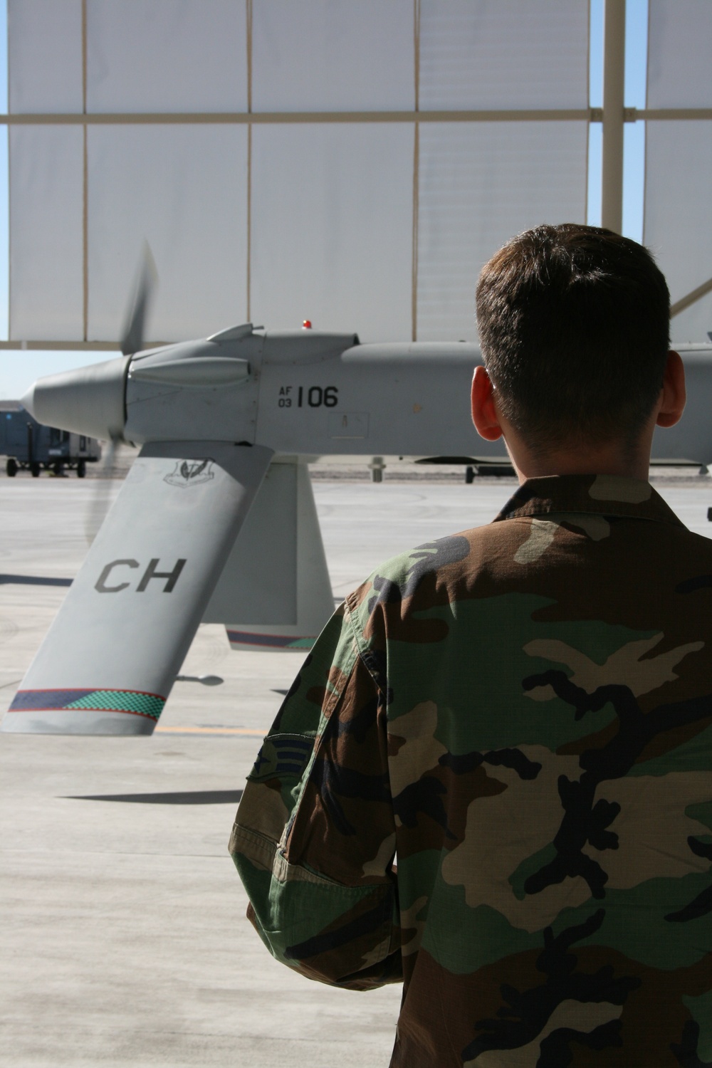 Air Force Crew Chief Prepares Predator Drone for Launch