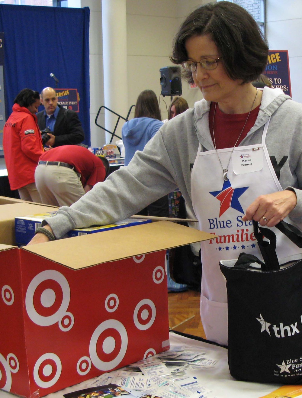 Army Wife Volunteers to Pack Care Packages for Troops on Veterans Day