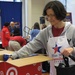 Army Wife Volunteers to Pack Care Packages for Troops on Veterans Day