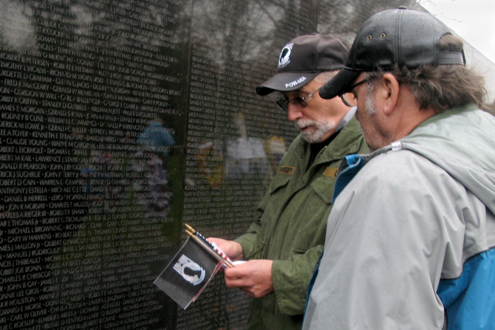 Solemn Remembrance at Vietnam Veterans Memorial Wall