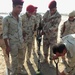 Soldiers Uncover Buried Object During Mine Detector Training in Iraq