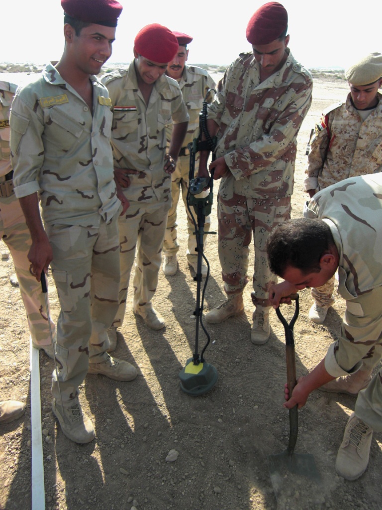 Soldiers Uncover Buried Object During Mine Detector Training in Iraq
