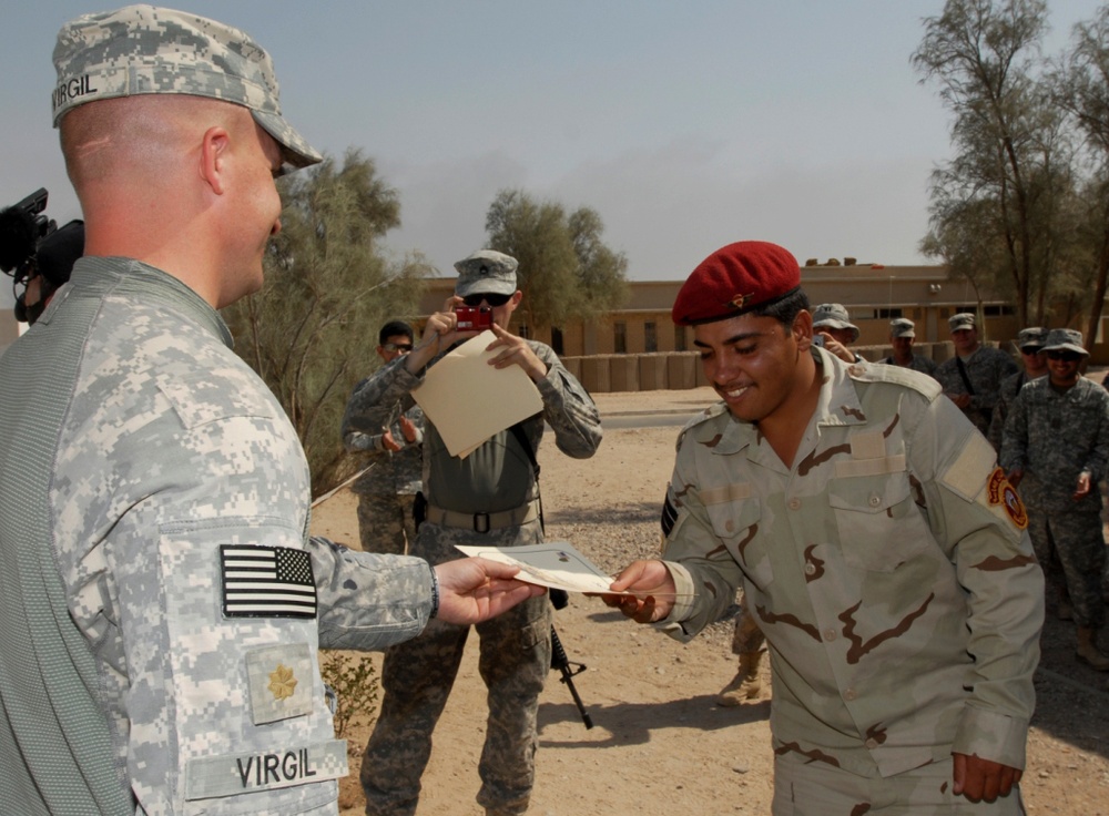 U.S. Army Officer Presents Training Certificate to Iraqi Soldier