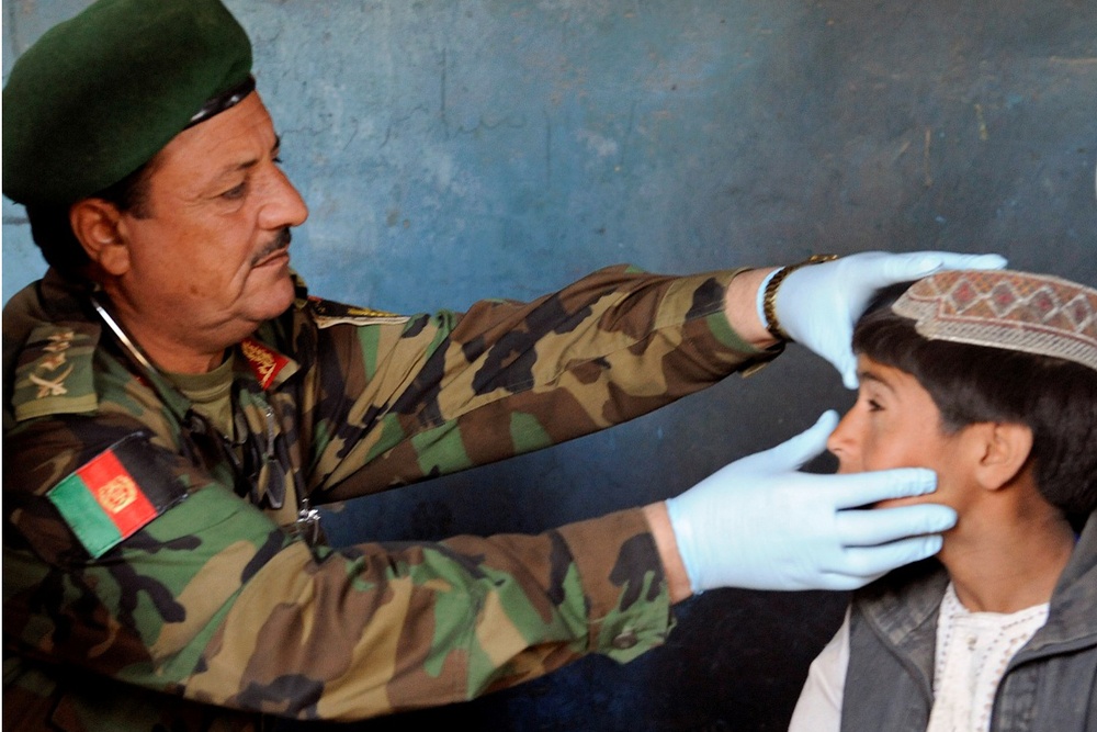 Afghan Army Colonel Provides Medical Care to Local Afghans