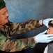Afghan Army Colonel Provides Medical Care to Local Afghans