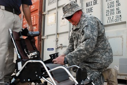 Army Master Sgt. Assembles Wheelchairs for Iraqi Children
