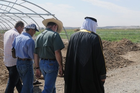 U.S. Agriculture Specialist Walks with Iraqi Farmers Near Mosul