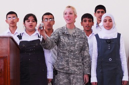 Army Sgt. Performs Iraqi National Anthem with Students in Basra
