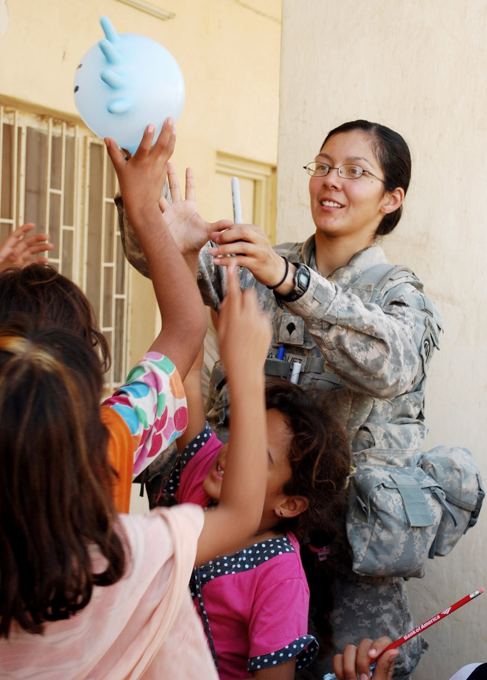 U.S. Soldier Brings Joy to Iraqi Girls with Balloon Animal