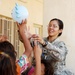 U.S. Soldier Brings Joy to Iraqi Girls with Balloon Animal
