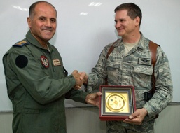 Former Foes Now Allies: Iraqi and U.S. Air Force Officers Shake Hands in Iraq