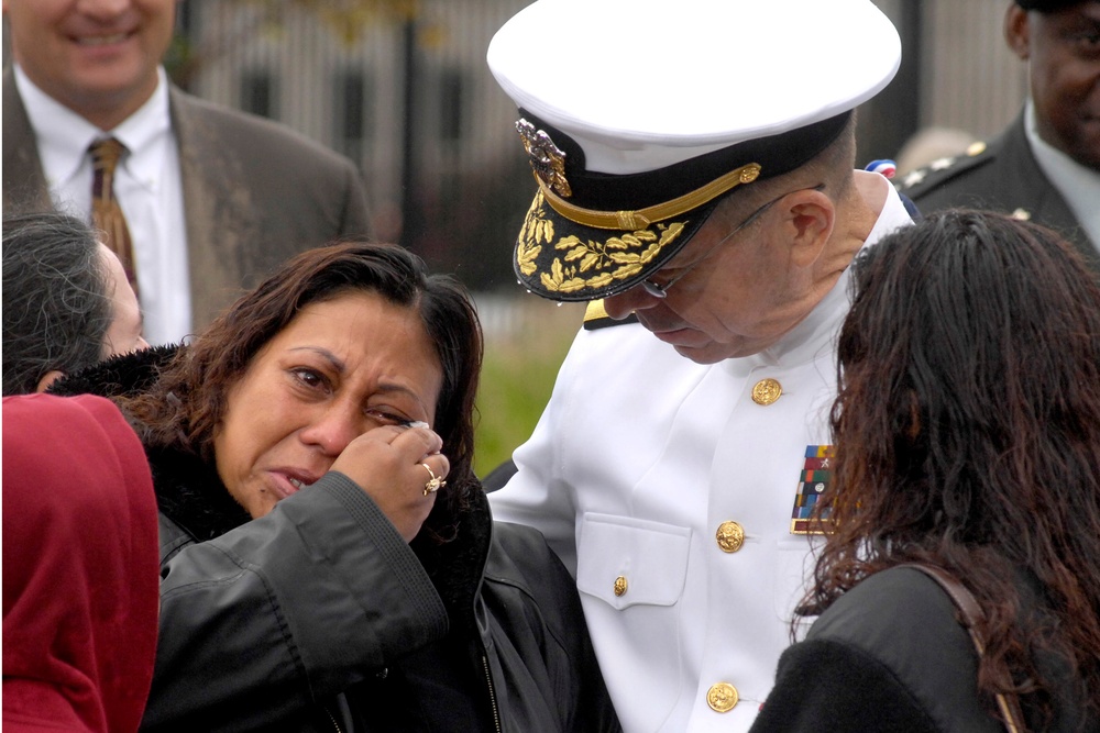 Adm. Mike Mullen Comforts Family at Pentagon Memorial