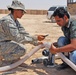 U.S. Soldier and Iraqi Engineer Demonstrate Solar-Powered Water Filtration System