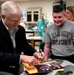 Defense Secretary Honors Wounded Veteran at Rehab Center
