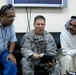 Army Officer, Iraqi Sheik, and Interpreter Discuss Photos in Iraq