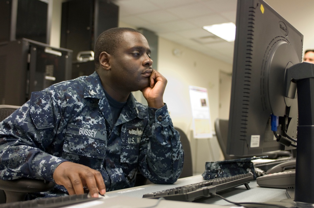 Navy Petty Officer Trains on Global Command and Control System