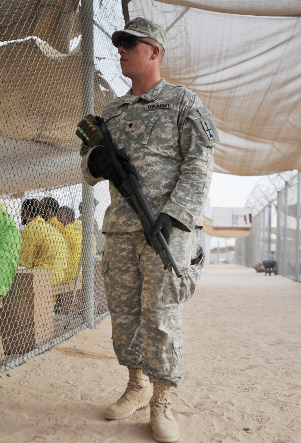 Army Spc. Guards Detainees at Camp Bucca, Iraq
