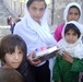 Afghan Girls Proudly Display New School Supplies