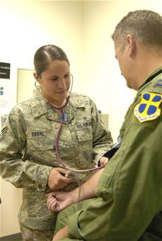 Air Force Medic Checks Patient's Blood Pressure at Edwards AFB