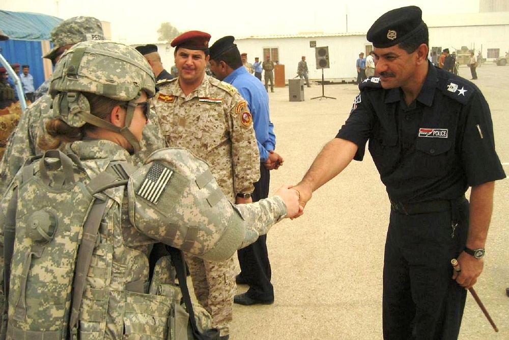 U.S. Soldiers Meet with Iraqi Police Recruits at Graduation Ceremony in Maysan Province