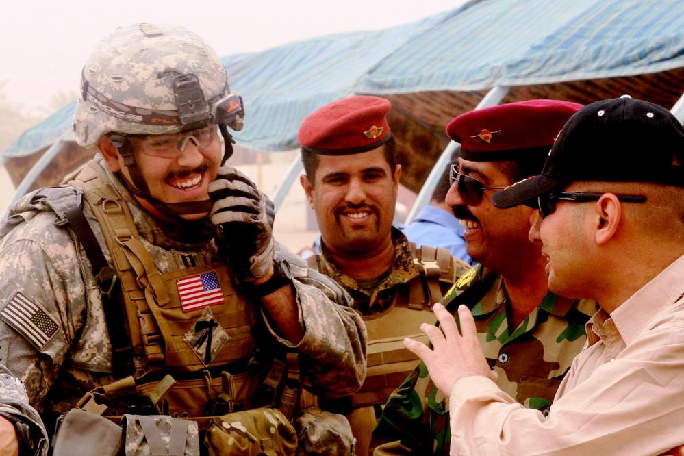 U.S. Army Captain Meets with Iraqi Police Recruits After Graduation Ceremony