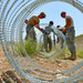 Soldiers Fortify Afghan Outpost with Concertina Wire